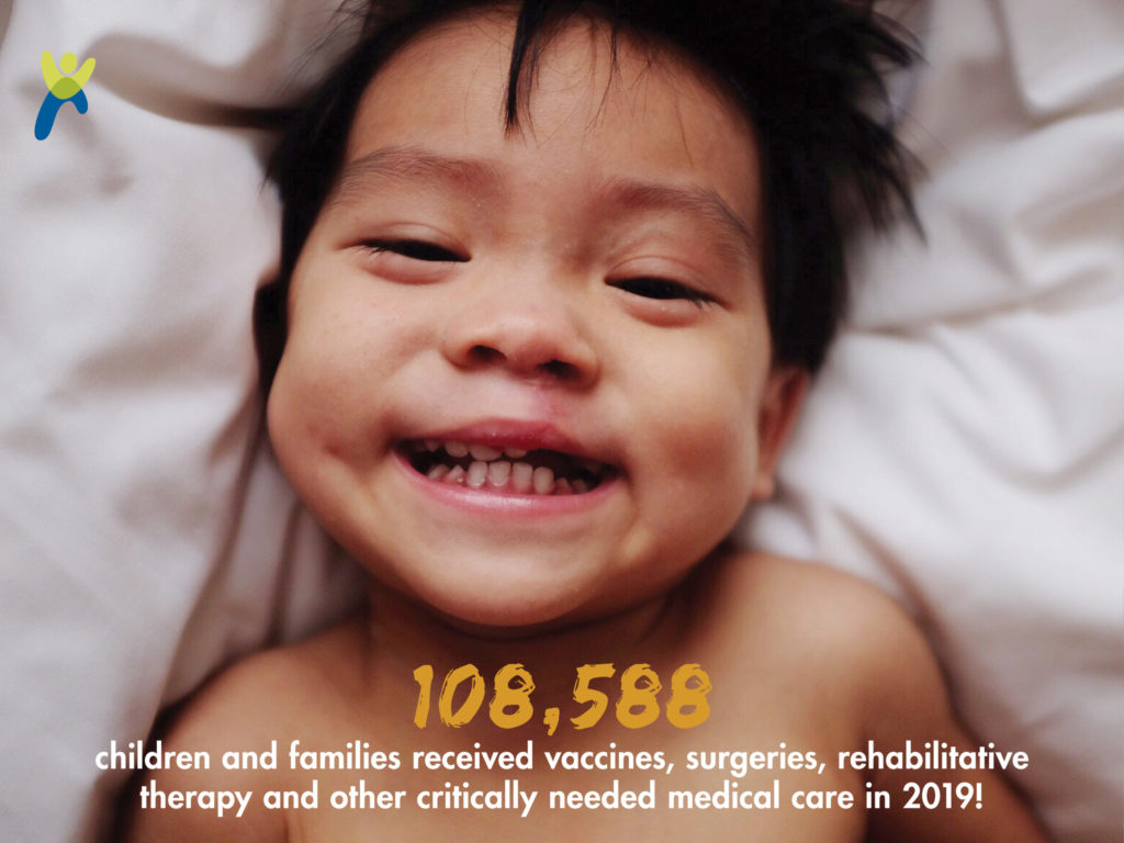 Young child lying on his back in a bed smiling_graphic showing 108,588 children and families received vaccines surgeries rehabilitative therapy and other critically needed medical care in 2019