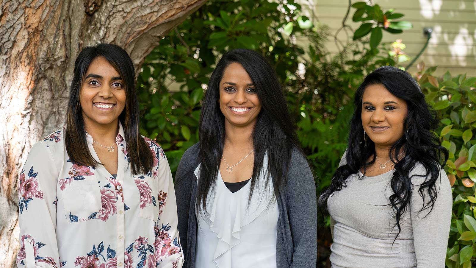 three women from indian smiling