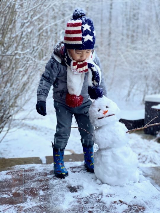 Camon building a snowman during quarantine. 