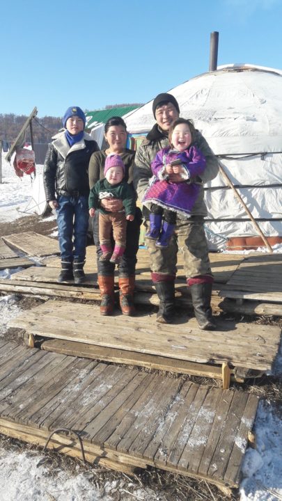 One of the three families who received a herd of sheep and goats.