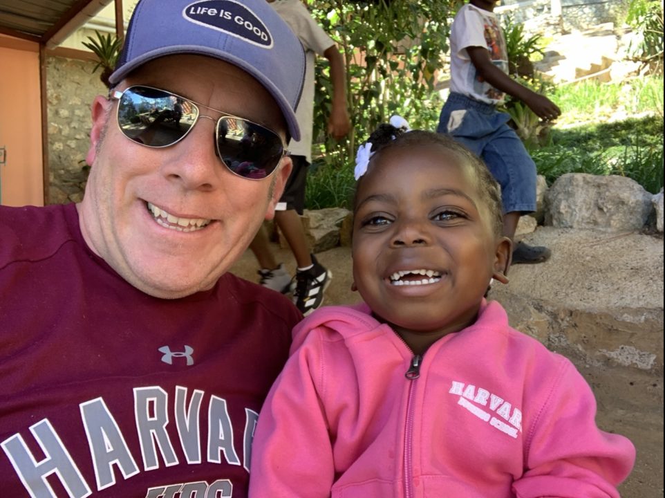 Brian with Gracie during one of his visits to see her in Haiti. 
