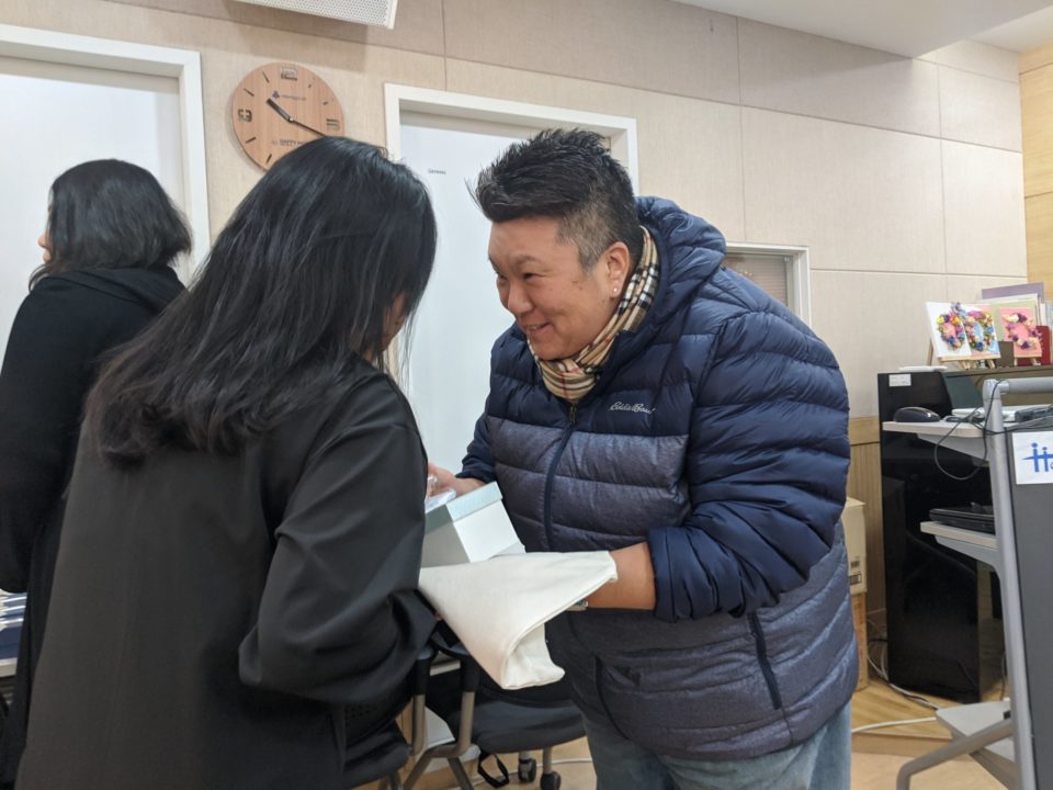 Kate (right) during her visit to the Morning Garden shelter on the Holt gift team trip to Korea. 