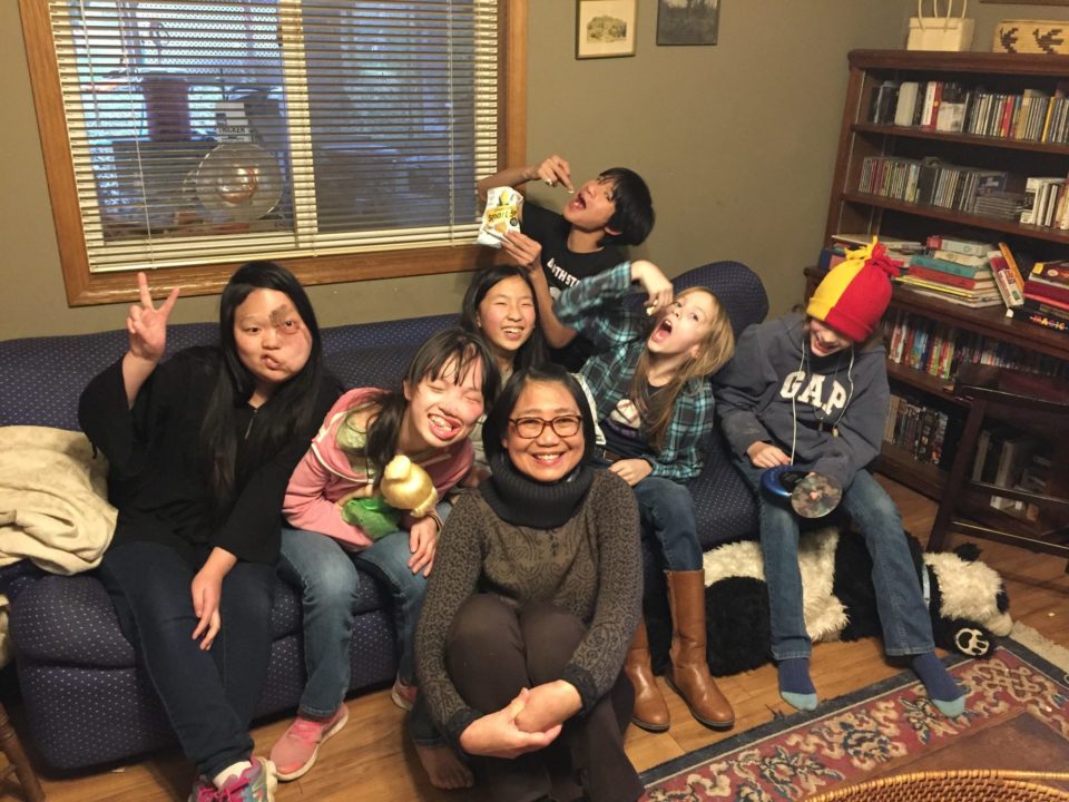 May May Tchao (center) and some of the Curry children at their first viewing of May May's new adoption documentary. May May and the Currys filmed "Hayden and Her Family" for five years.