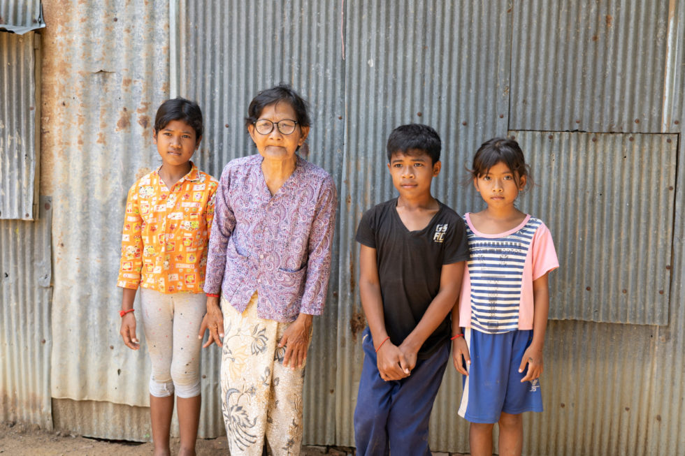 Kea (second from right) spent eight years in an orphanage in Cambodia before Holt social workers, child sponsors and donors helped him reunite with his grandma and siblings. 