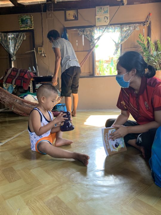 A child in Holt sponsorship plays with a toy he received as a gift from Holt sponsors and donors.