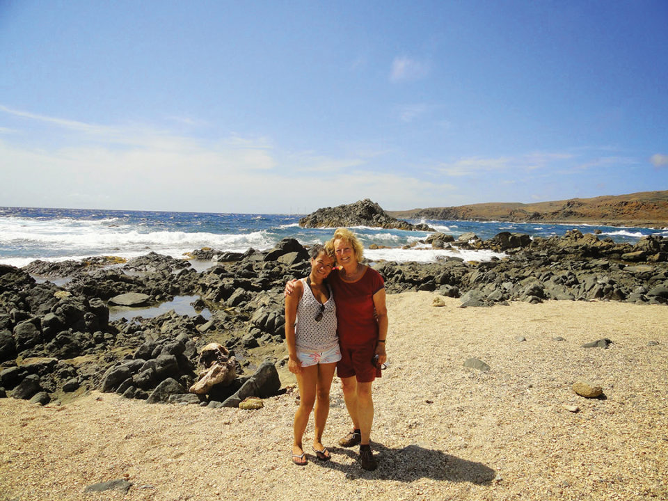 Clare poses for a picture with her mom during a family vacation in Aruba.