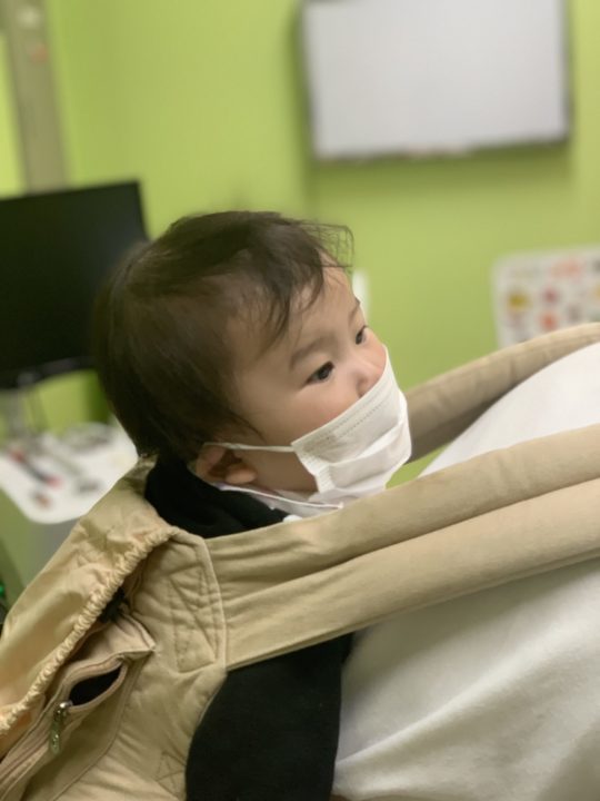 A baby in Holt's foster care program in Korea wears a mask. 