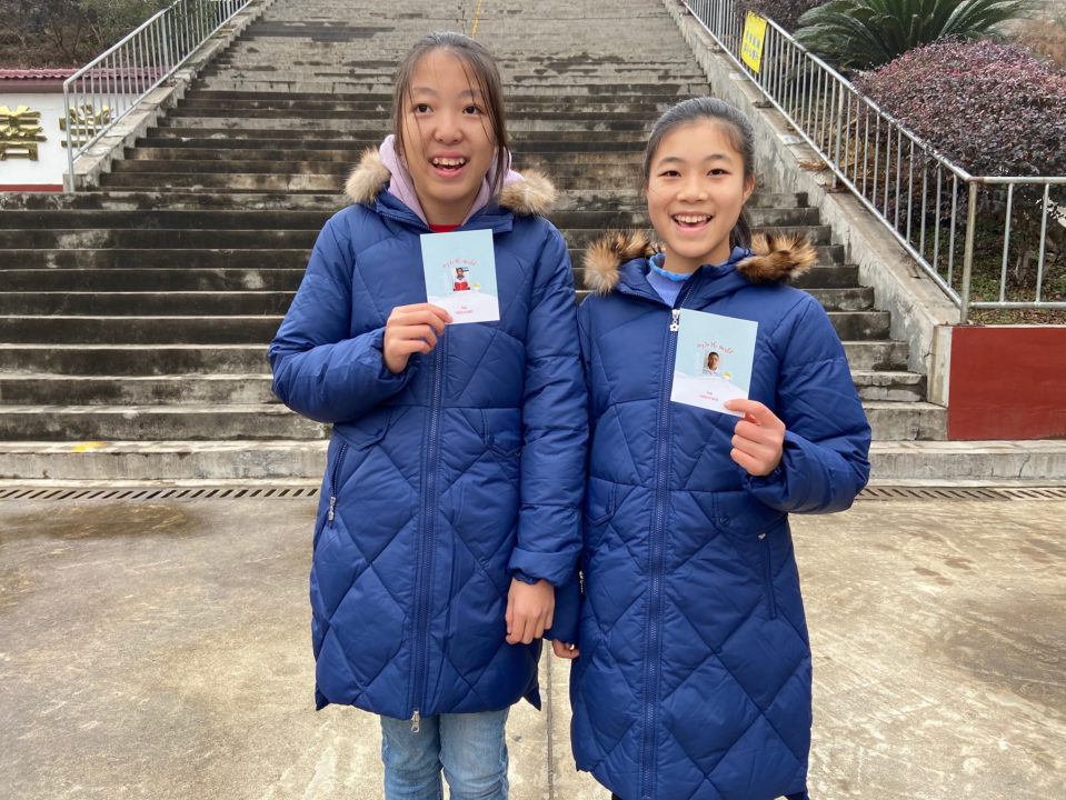 Students in Holt sponsorship in China hold Christmas cards from their sponsors!