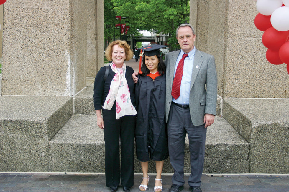 Adoptee and Holt child sponsor Clare Larson with her mom and dad at her college graduation in 2009.