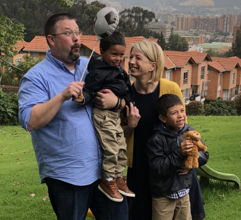 The Traver family adopted 7- and 4-year-old brothers William and Jeison. Here they are in Colombia on their adoption day. 