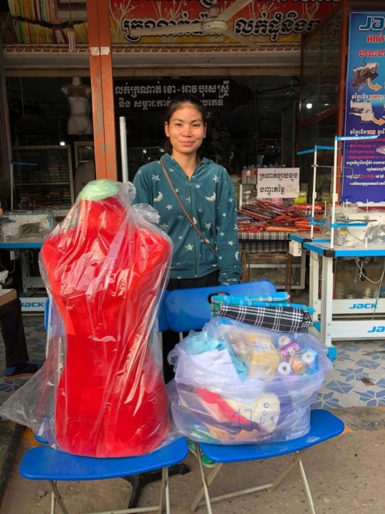 After losing her job due to the pandemic, a mom in Holt's family strengthening program received the materials to start a sewing business. 