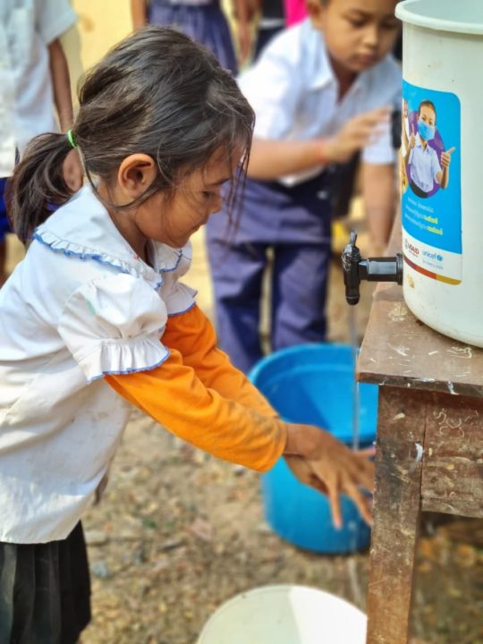 With donor support, Holt Cambodia distributed soap and clean water to keep kids safe from COVID. 