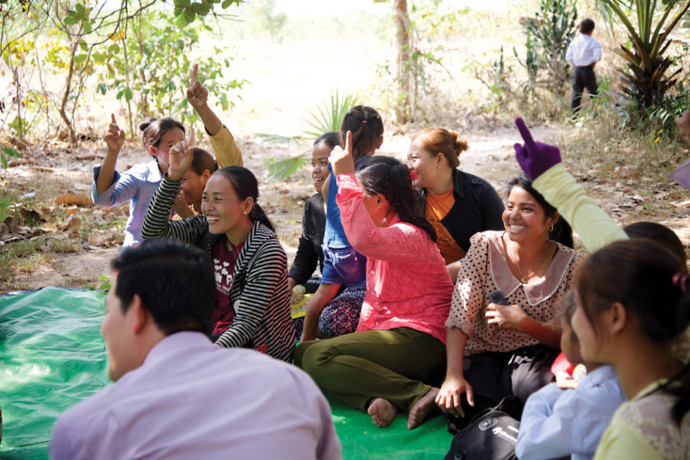 The Brave Women laugh during a group meeting.