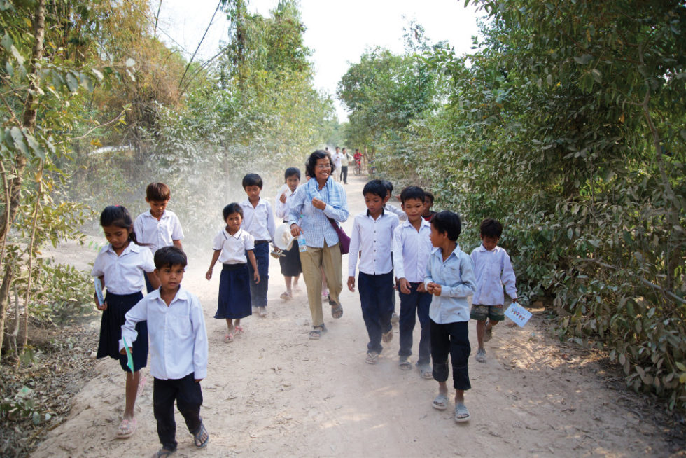 Buth, the director of Holt’s on-the-ground partner Child and Life Association, walks with children in Holt’s sponsorship program.