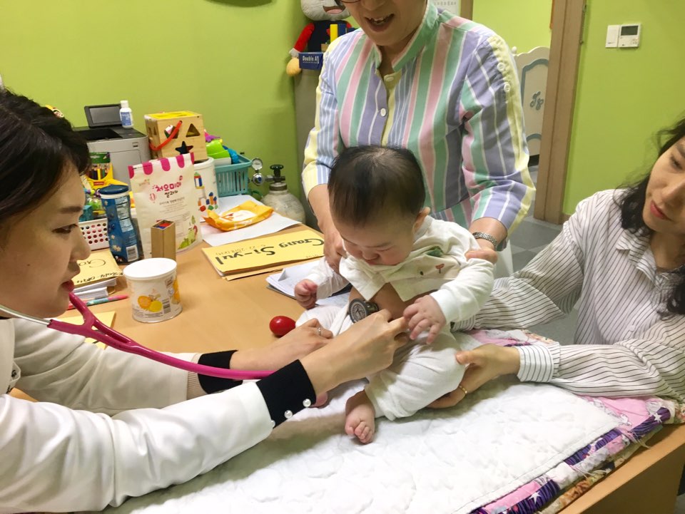 A baby in Holt foster care in Korea receives a medical check-up. In Korea, the cost of care is higher than in many of the countries where Holt works. 