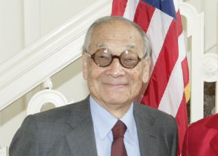 man in glasses smiling at camera