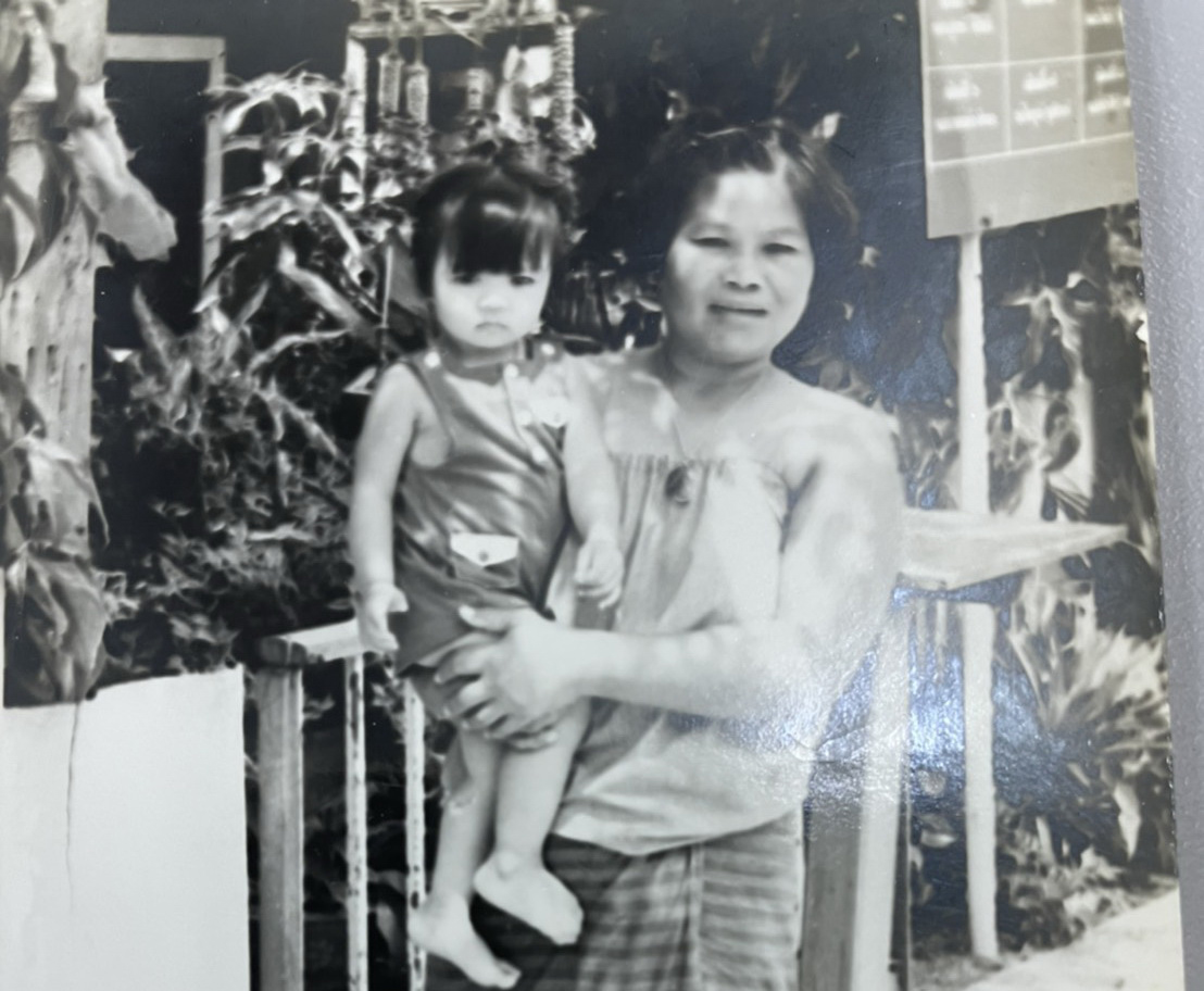 scanned black and white photo of woman holding small girl