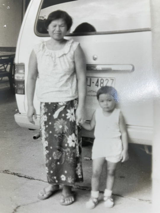 Mrs. Bayan with one of the children she cared for as a Holt foster mother in Thailand.