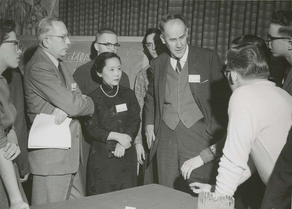 historical photo of group of men and one woman