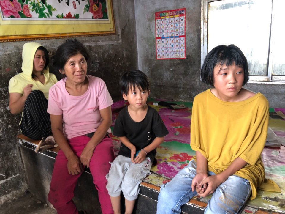 Thao and her family before Holt helped meet their needs. 