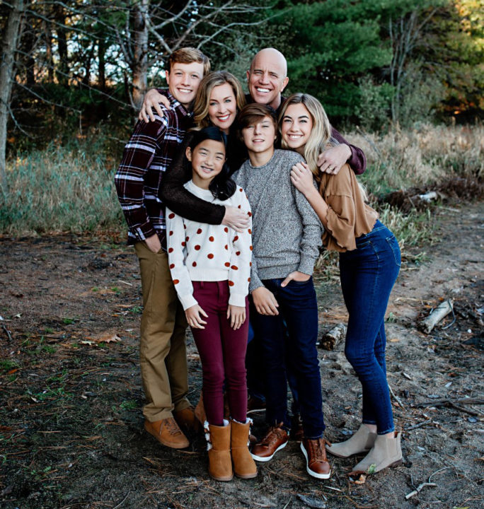 Melia with her parents, Ryan and Katie, and her three older siblings. 