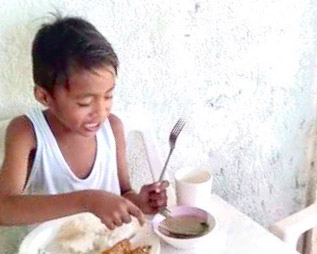 jovan eating a meal happy showing jovans health improved