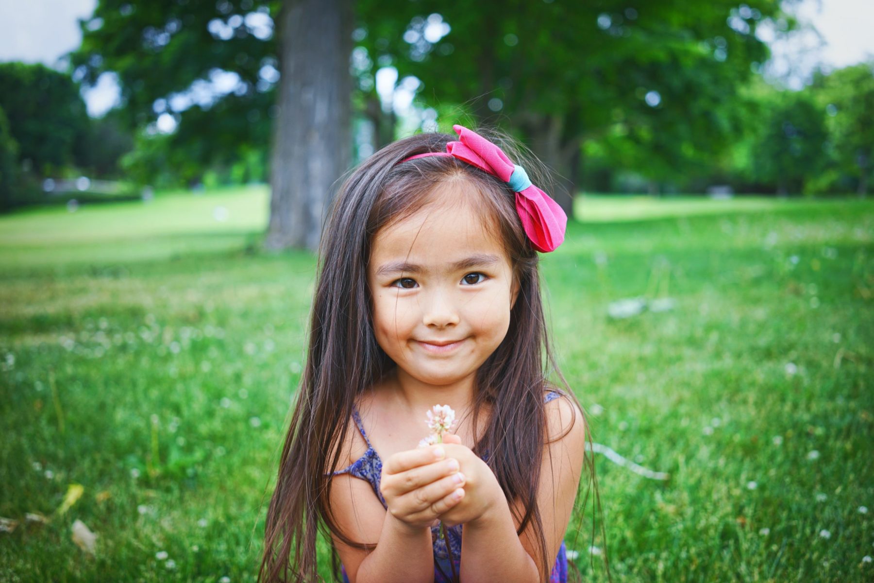 stock photo of older girl looking at camera to represent children adopting from taiwan