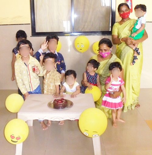 Children celebrating with cake in India