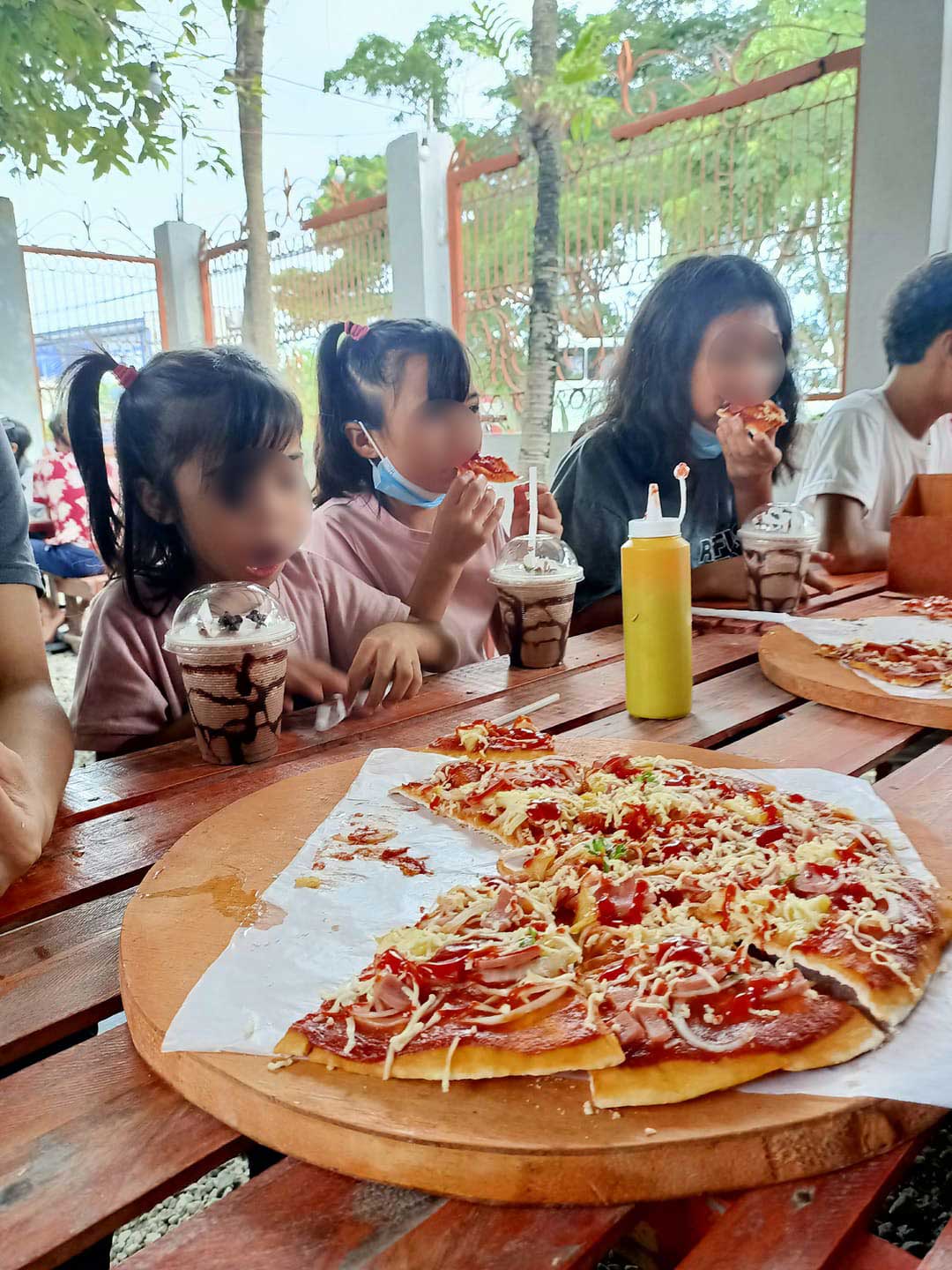 Children having pizza party in Philippines
