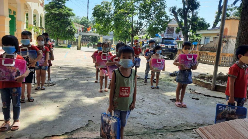 Children holding gift bags