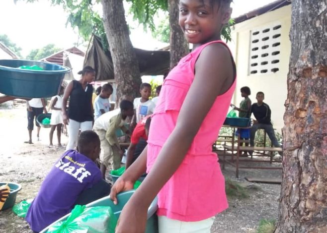 Girl helping move supplies 