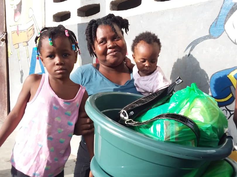 Mother and children with belongings after earthquake