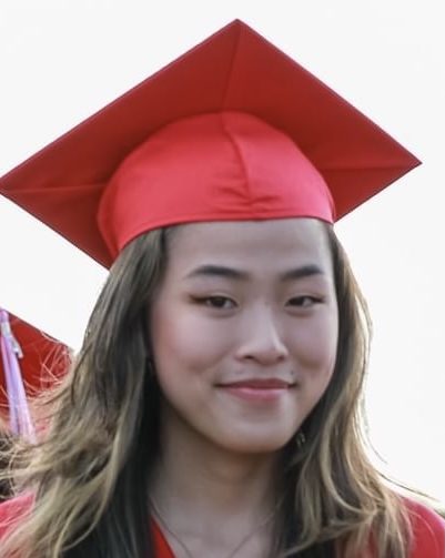 girl wearing red graduation cap and gown