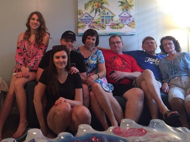 family sitting on couch
