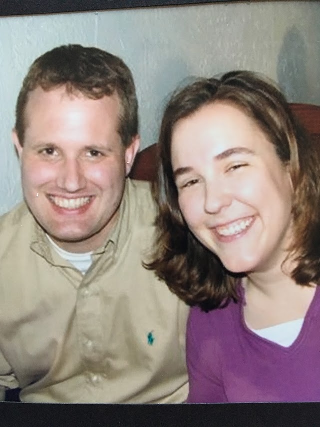 scanned photo of smiling man and woman