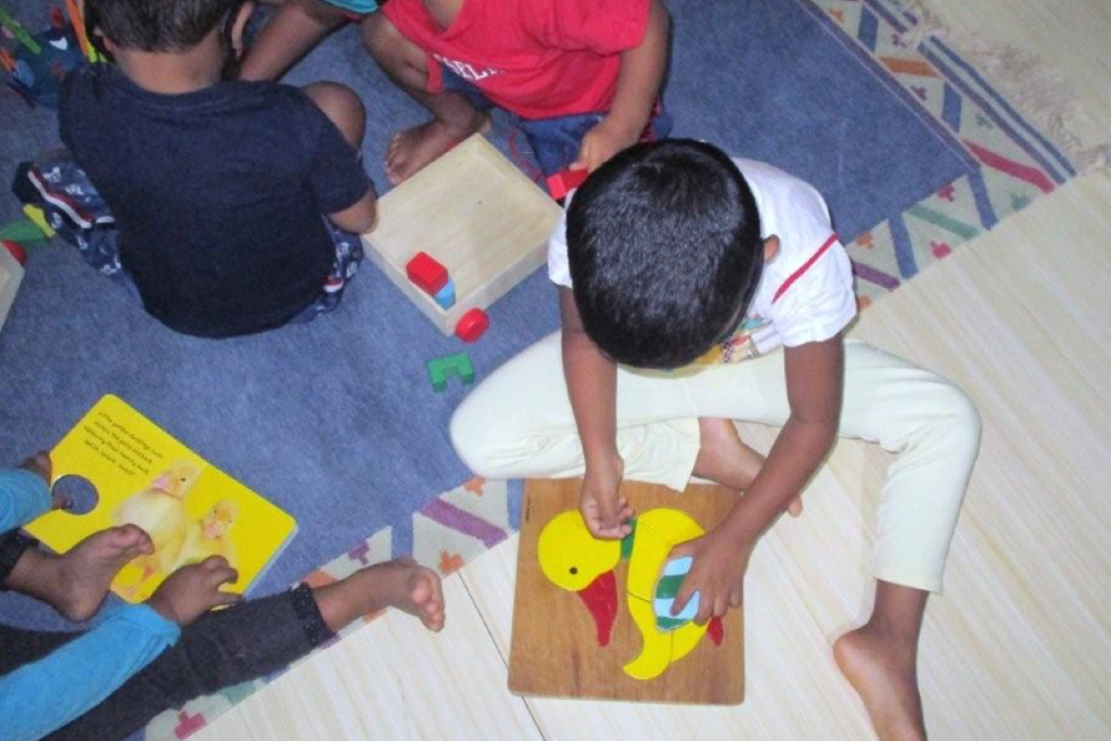 children playing on the floor in india