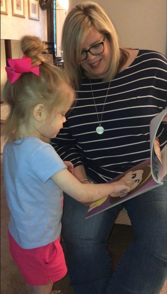 woman reading to a young girl