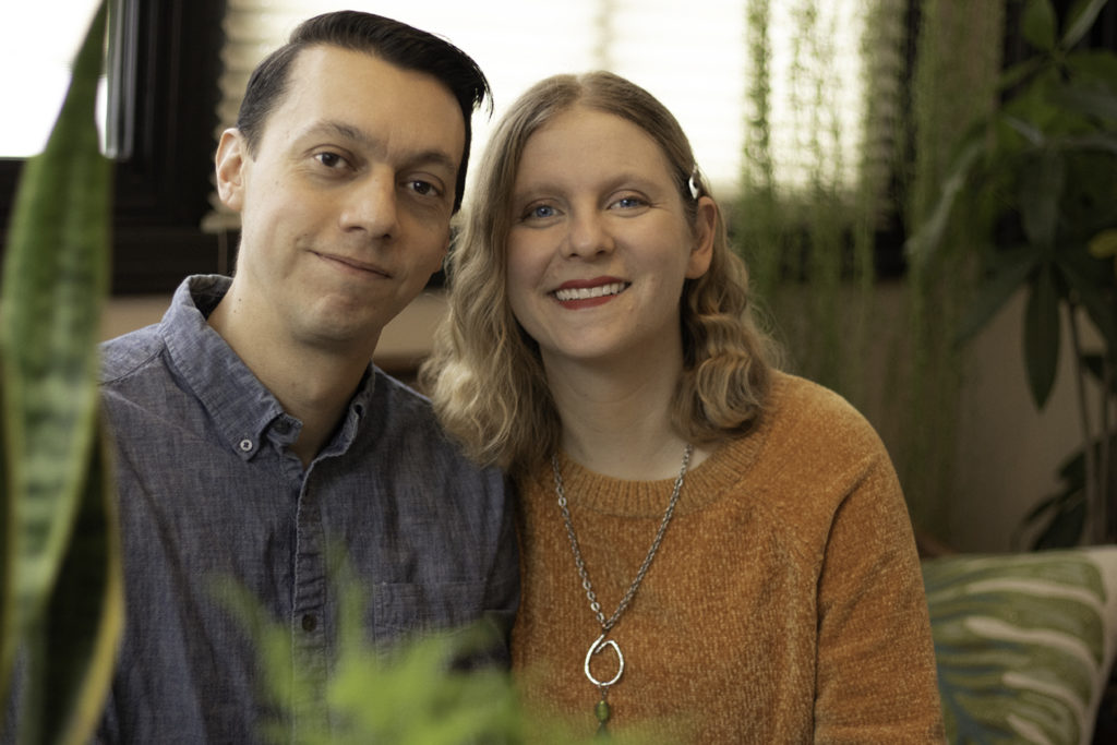 man and blonde woman smiling at camera