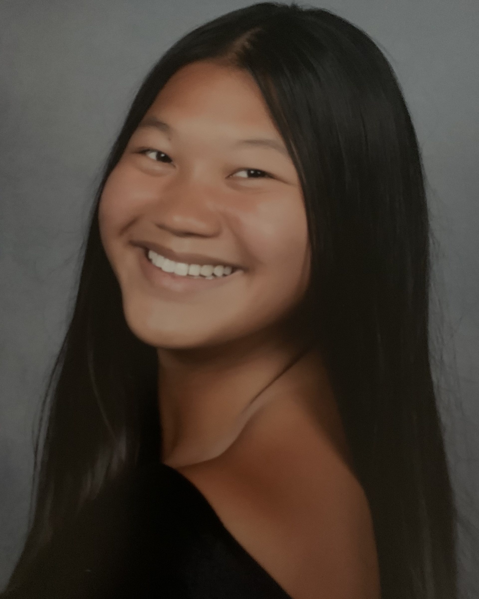 smiling girl looking over her shoulder