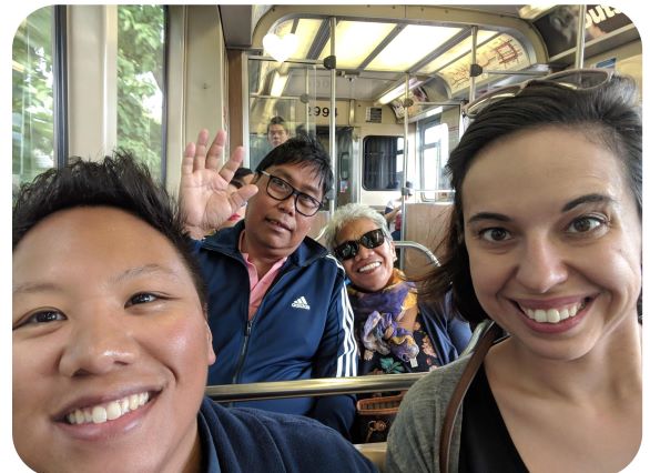 selfie of four people on public transportation