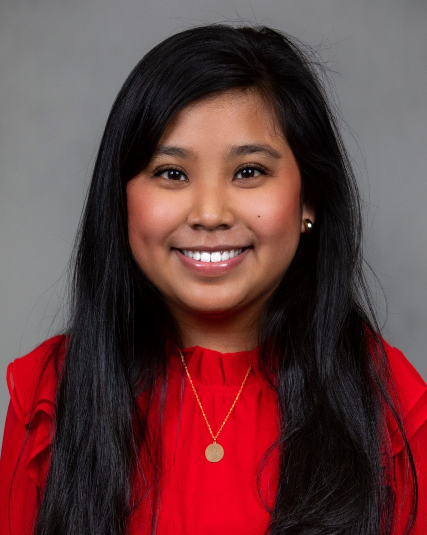 school photo of smiling girl wearing red blouse