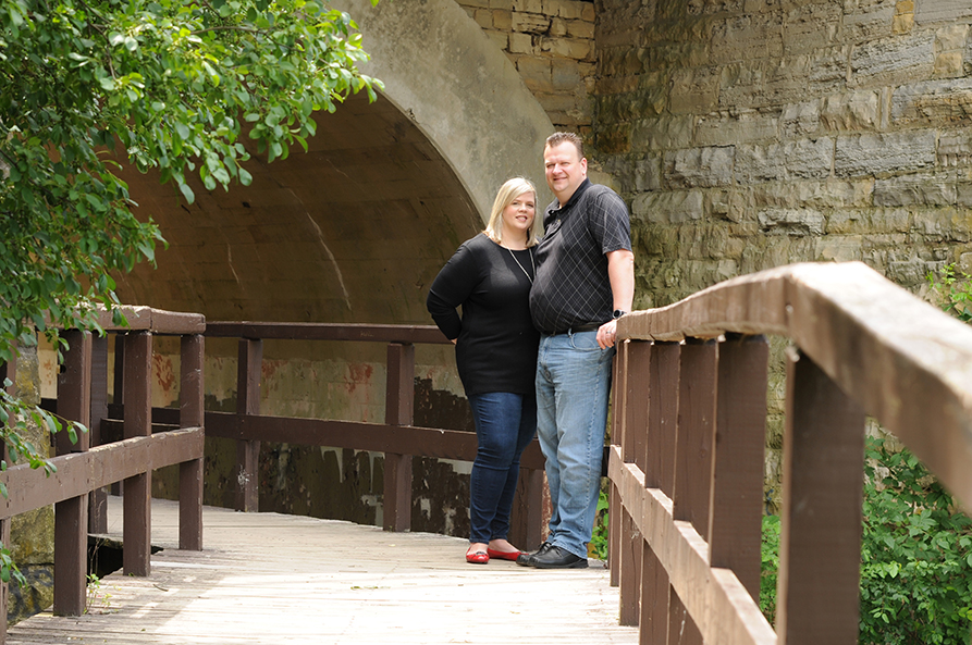 woman and man standing at a distance smiling