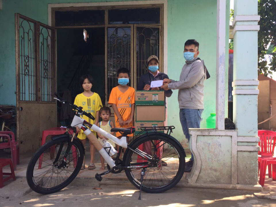 man delivering emergency food to family on a bike