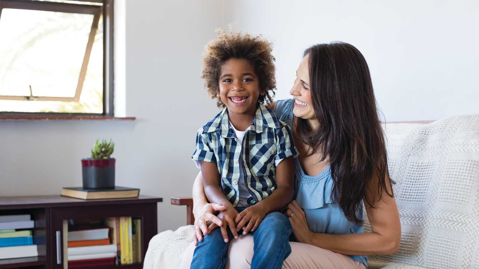 woman smiling at adopted son