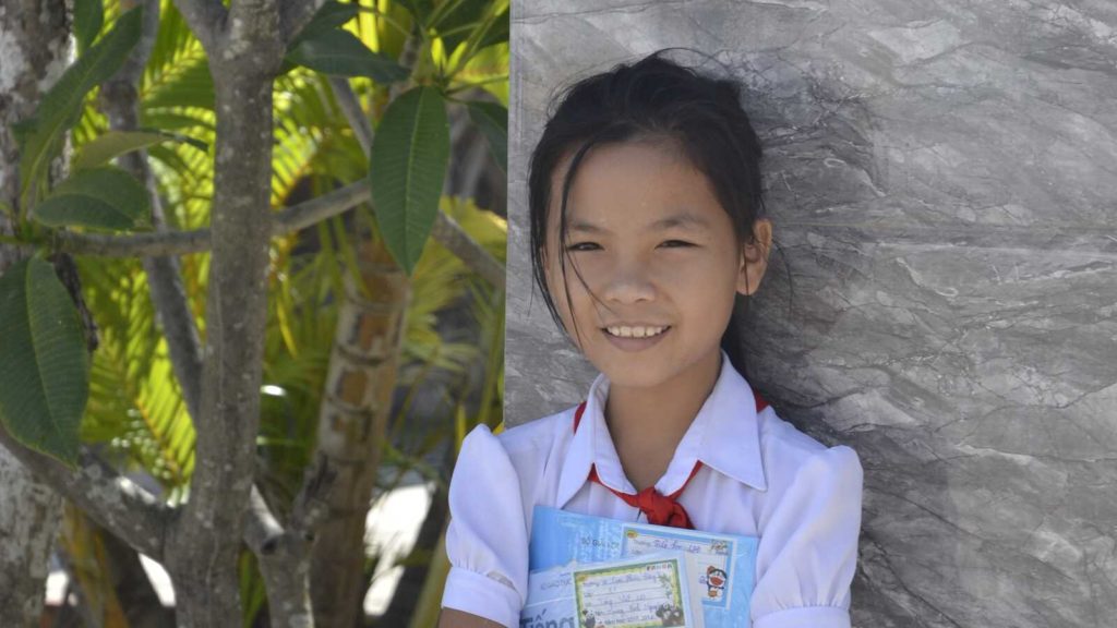 girl smiling with books