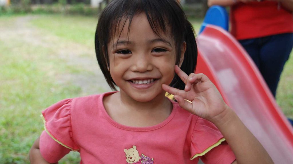 Gril smiles for photo in the Philippines