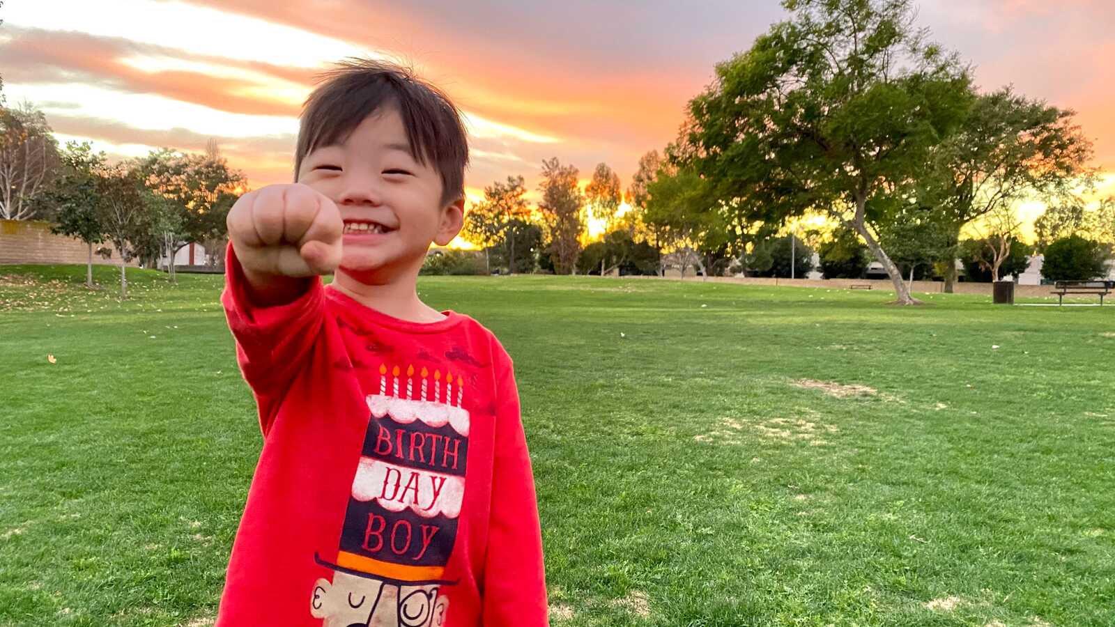 Smiling Korean boy in birthday shirt