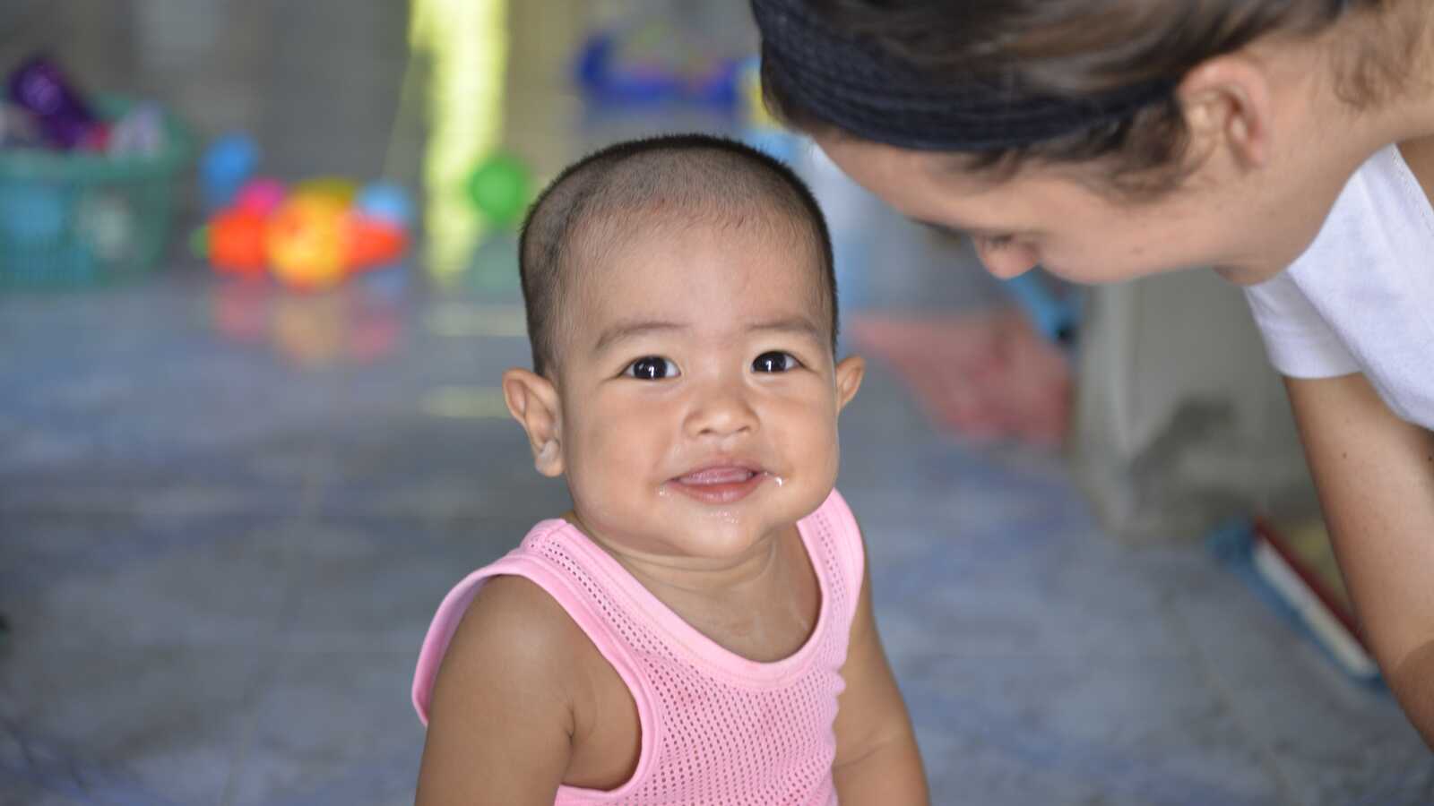 baby smiling in Thailand