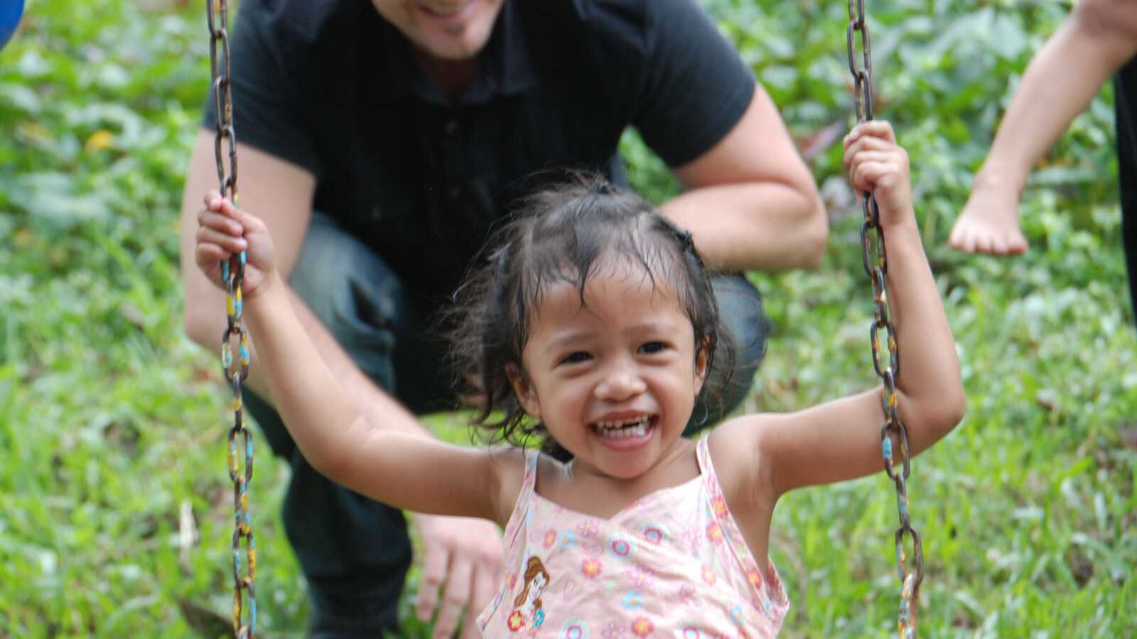 girl having fun on swing in the Philippines