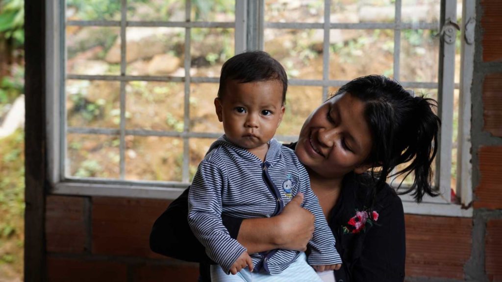 Colombian mother holding son